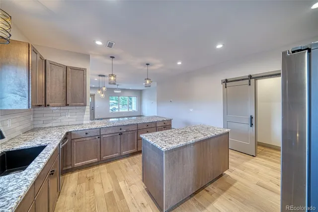 a kitchen with a refrigerator and countertop