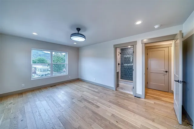 a bathroom with a shower sink and mirror