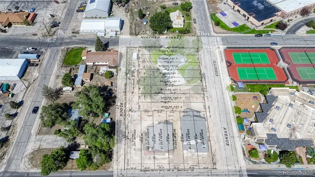 an aerial view of multiple houses with outdoor space