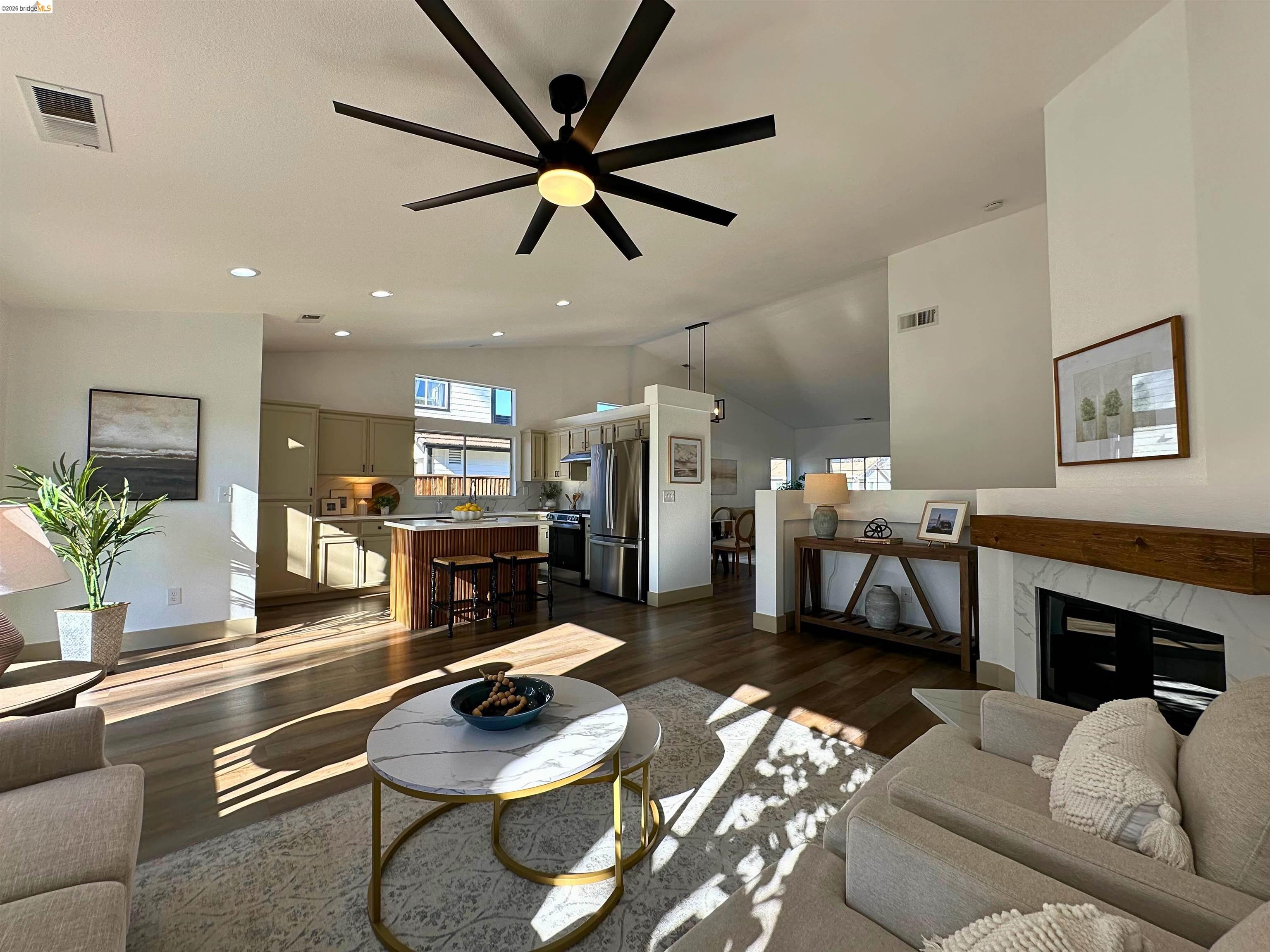 3075 Shiles Loop Brentwood, CA 94513 - Photo 16 of 37 Living area featuring dark wood-style flooring, lofted ceiling, a ceiling fan, and recessed lighting