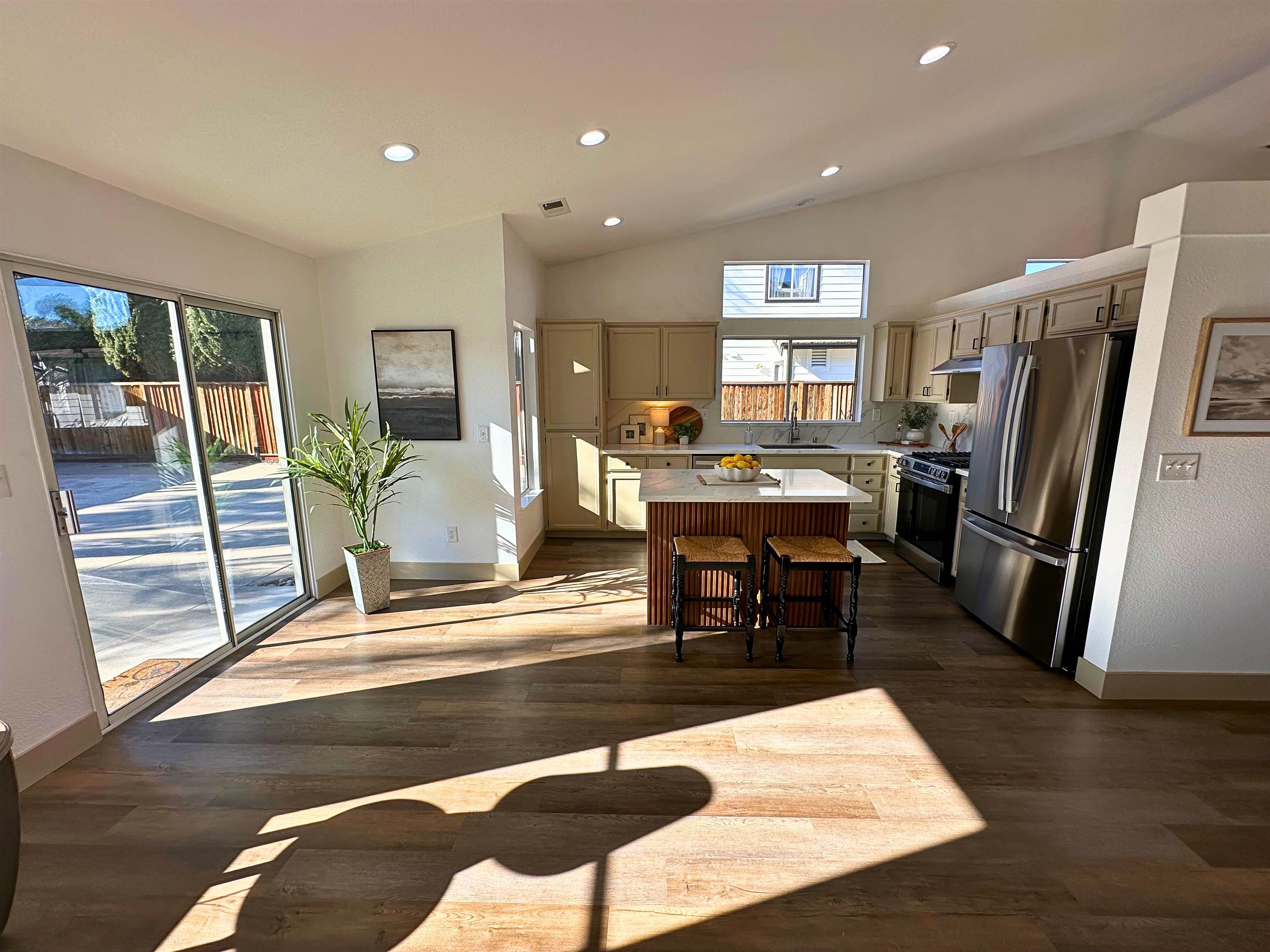 3075 Shiles Loop Brentwood, CA 94513 - Photo 18 of 37 a living room with stainless steel appliances furniture wooden floor and a table