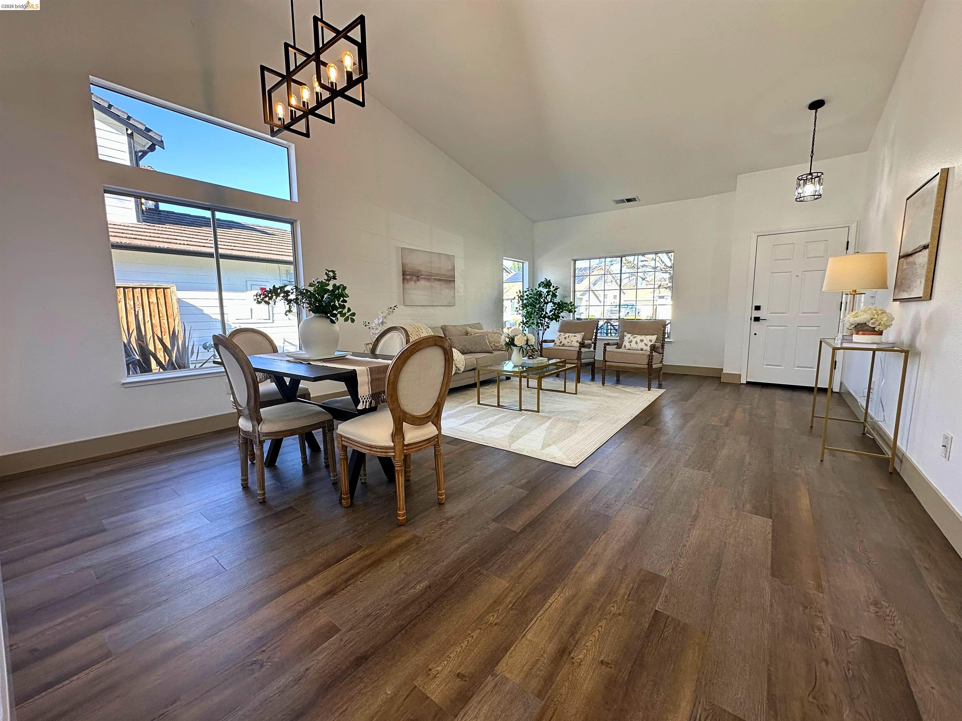 3075 Shiles Loop Brentwood, CA 94513 - Photo 29 of 37 Dining area featuring dark wood-type flooring and vaulted ceiling