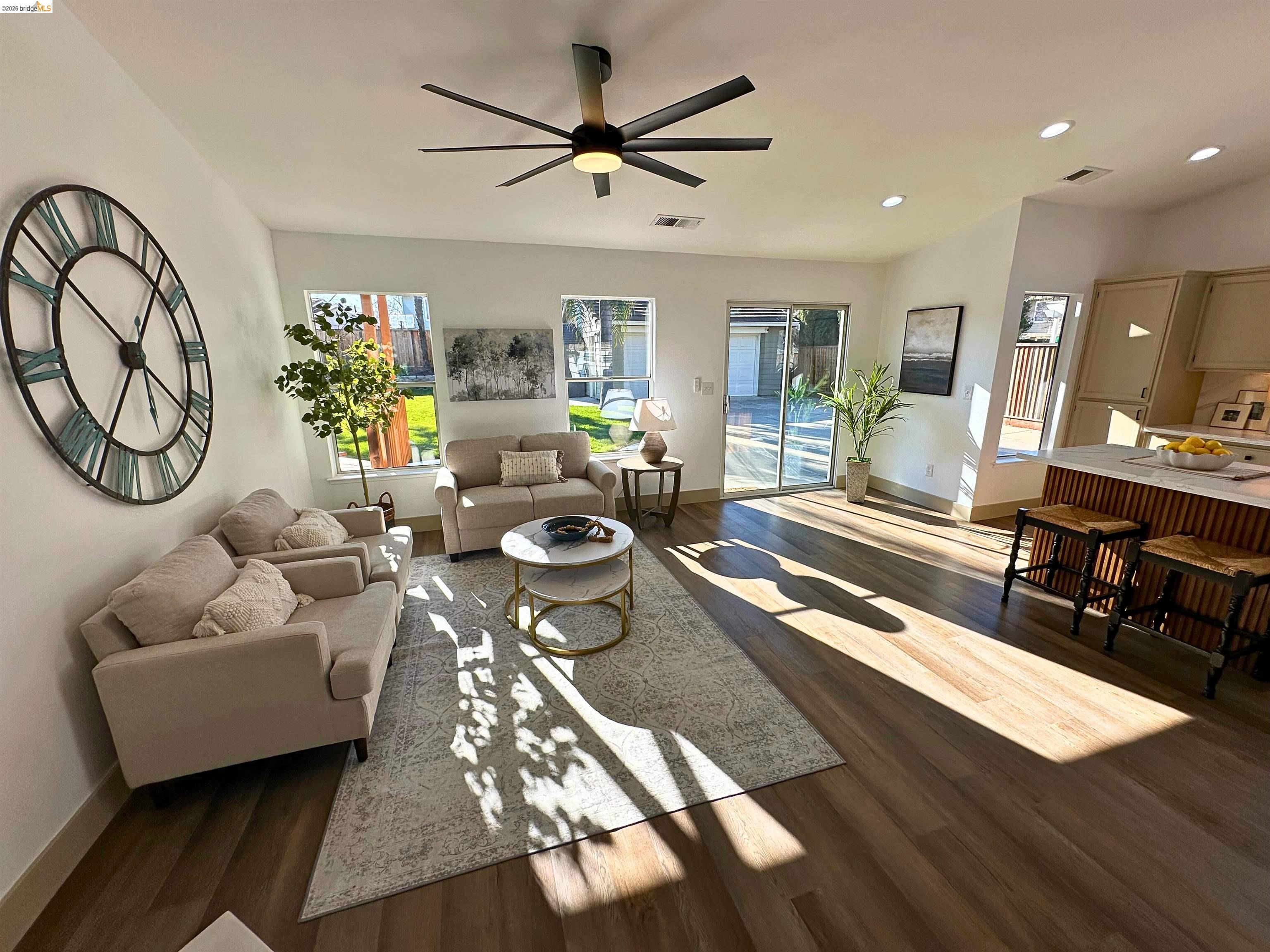 3075 Shiles Loop Brentwood, CA 94513 - Photo 33 of 37 Living area with dark wood-style flooring, recessed lighting, and a ceiling fan