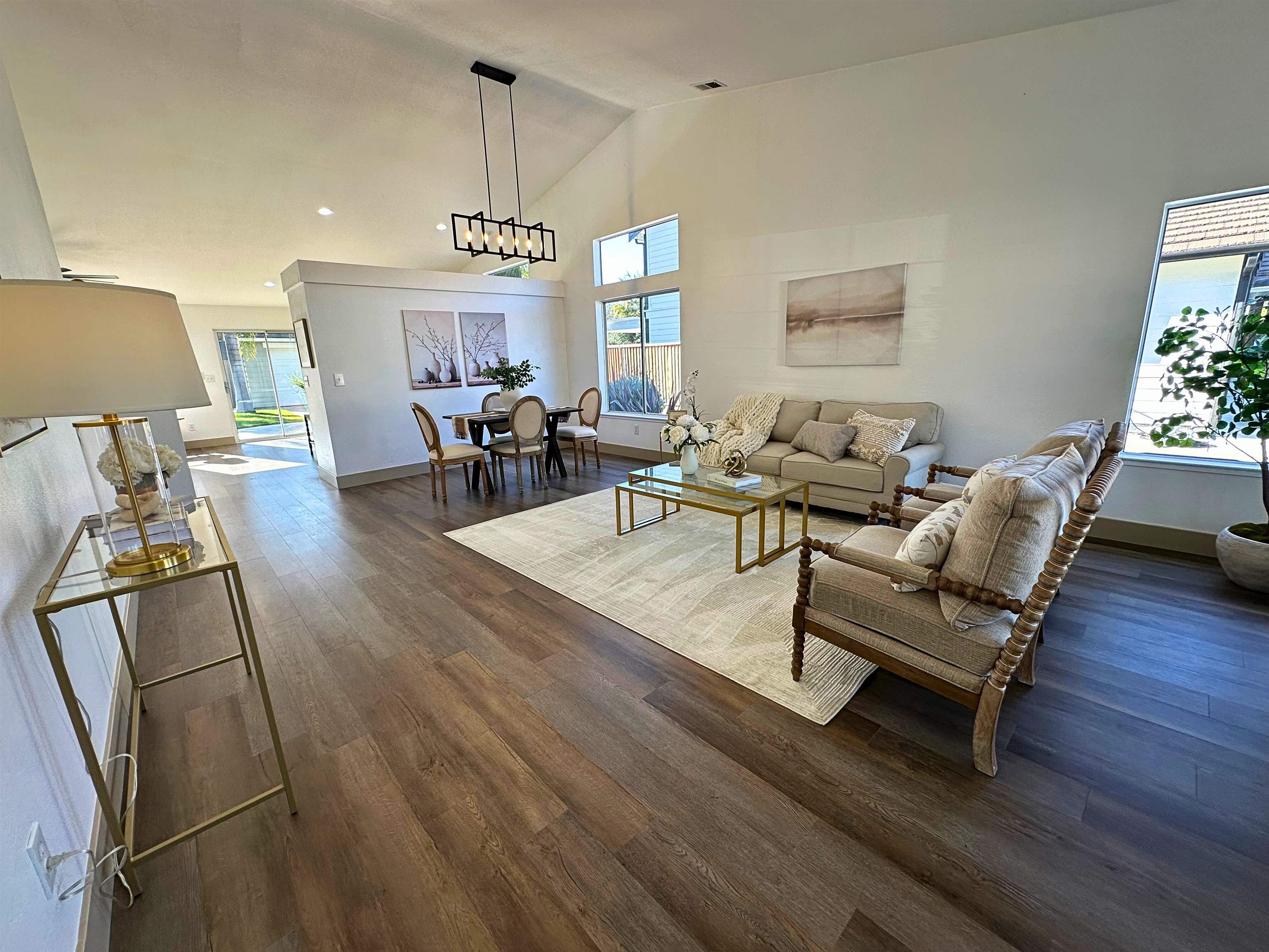 3075 Shiles Loop Brentwood, CA 94513 - Photo 6 of 37 a living room with furniture and a chandelier
