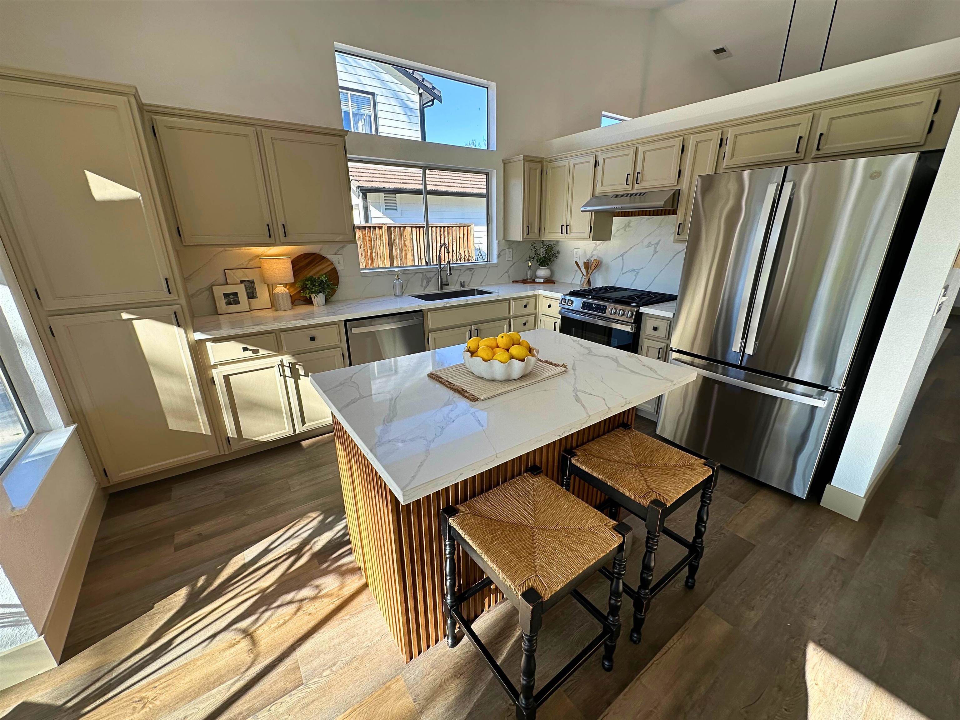 3075 Shiles Loop Brentwood, CA 94513 - Photo 10 of 37 a kitchen with a table chairs and a refrigerator