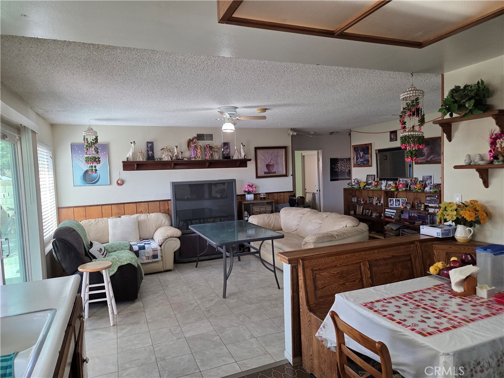 44047 Rodin Avenue Lancaster, CA 93535 - Photo 17 of 26 a living room with furniture and a rug