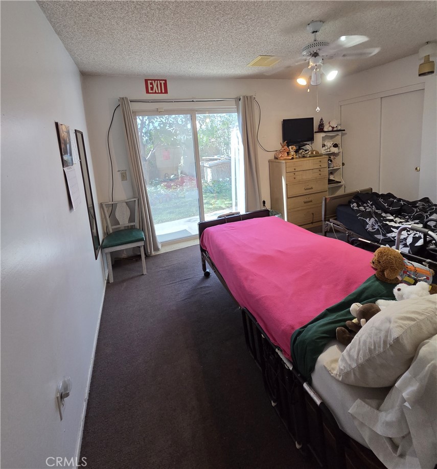 44047 Rodin Avenue Lancaster, CA 93535 - Photo 20 of 26 a bed room with a bed and a table