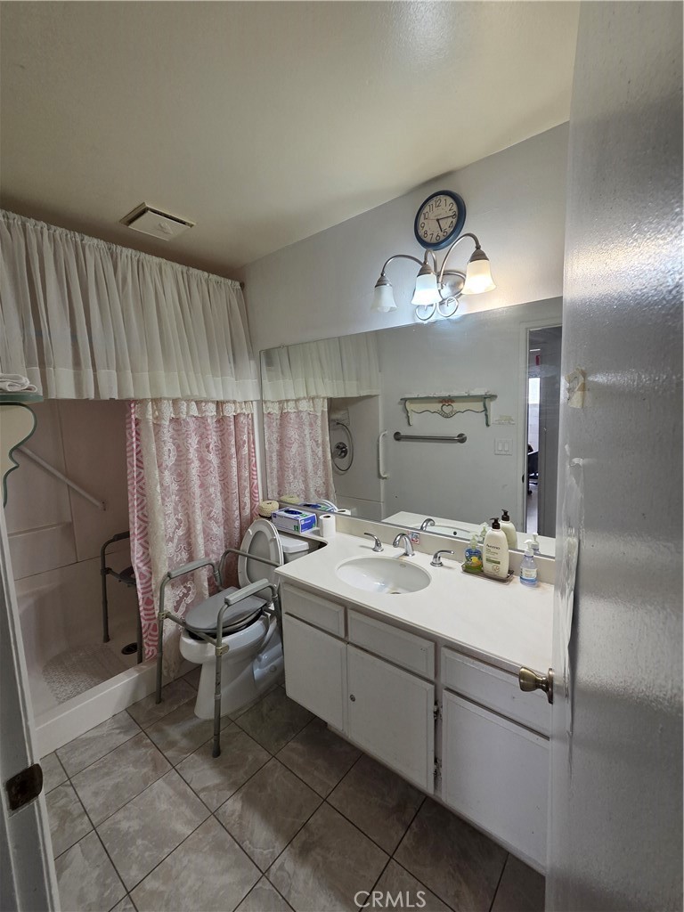 44047 Rodin Avenue Lancaster, CA 93535 - Photo 21 of 26 a bathroom with a sink and a mirror