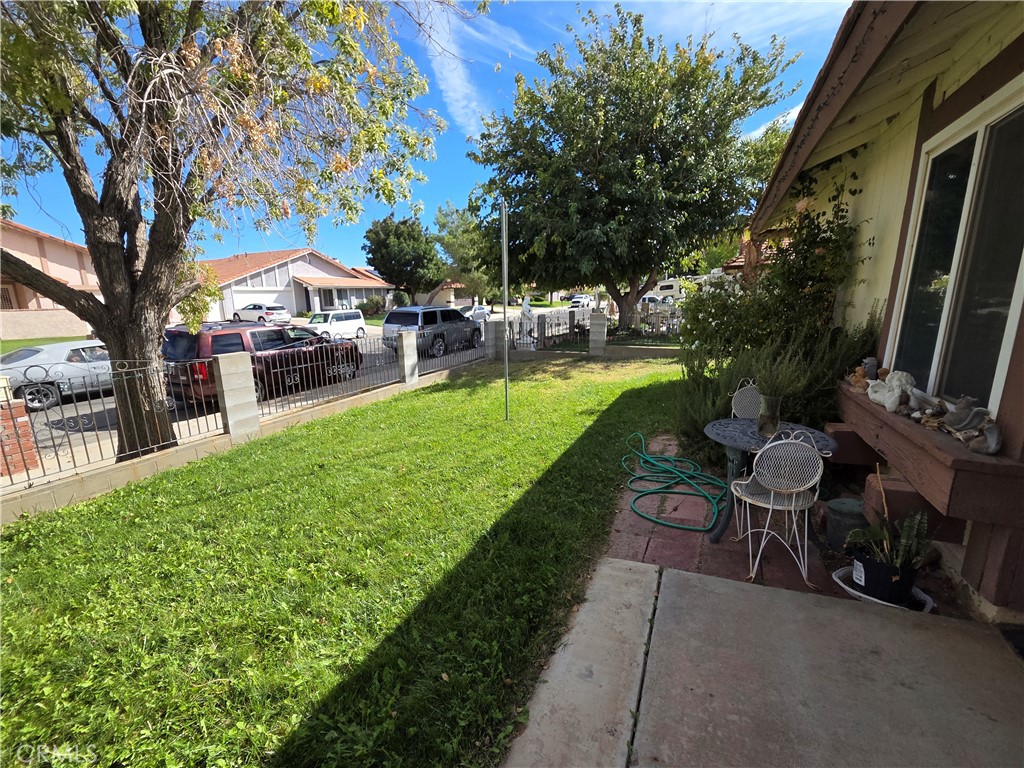 44047 Rodin Avenue Lancaster, CA 93535 - Photo 4 of 26 a view of a backyard with sitting area