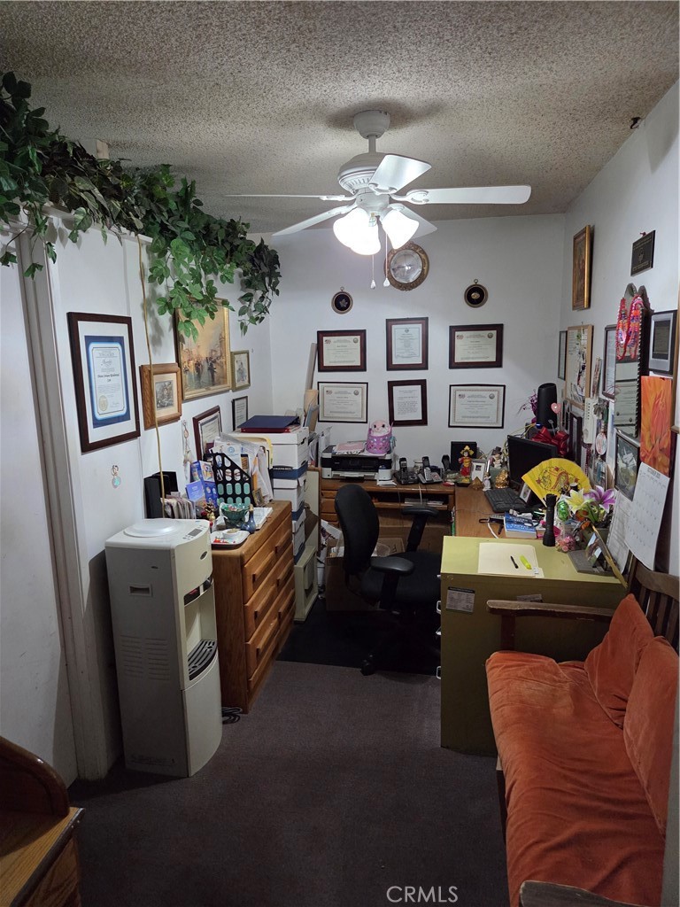 44047 Rodin Avenue Lancaster, CA 93535 - Photo 7 of 26 a living room with furniture and a flat screen tv