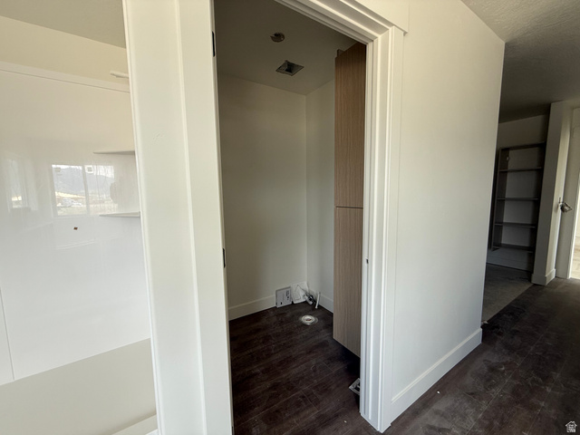 1008 West 3410 South Nibley, UT 84321 - Photo 16 of 26 Laundry room featuring wood-finish flooring and integrated cabinetry