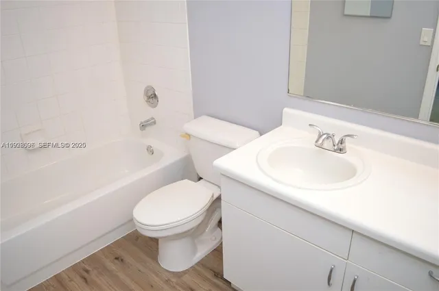 a bathroom with a sink toilet and bathtub