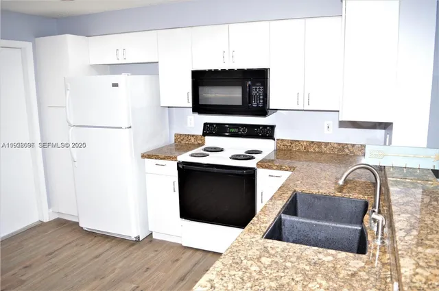 a room with furniture and a flat screen tv