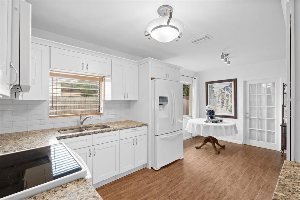 755 43rd Street St. Petersburg, FL 33713 - Photo 12 of 46 a kitchen with a sink stove and cabinets