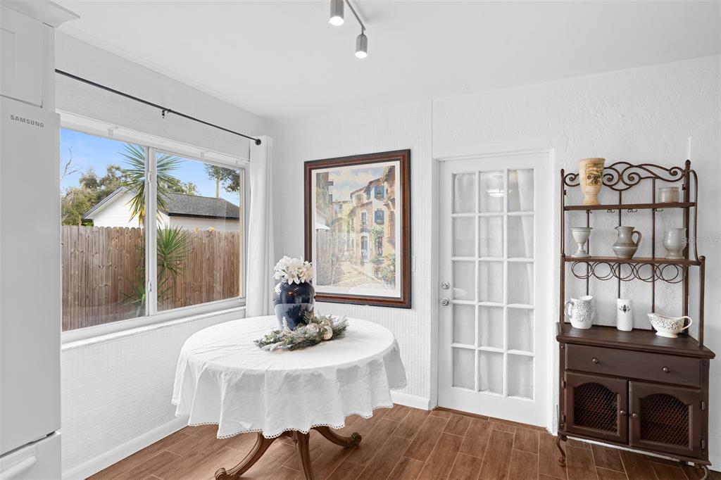755 43rd Street St. Petersburg, FL 33713 - Photo 14 of 46 a living room with furniture a table and a fireplace