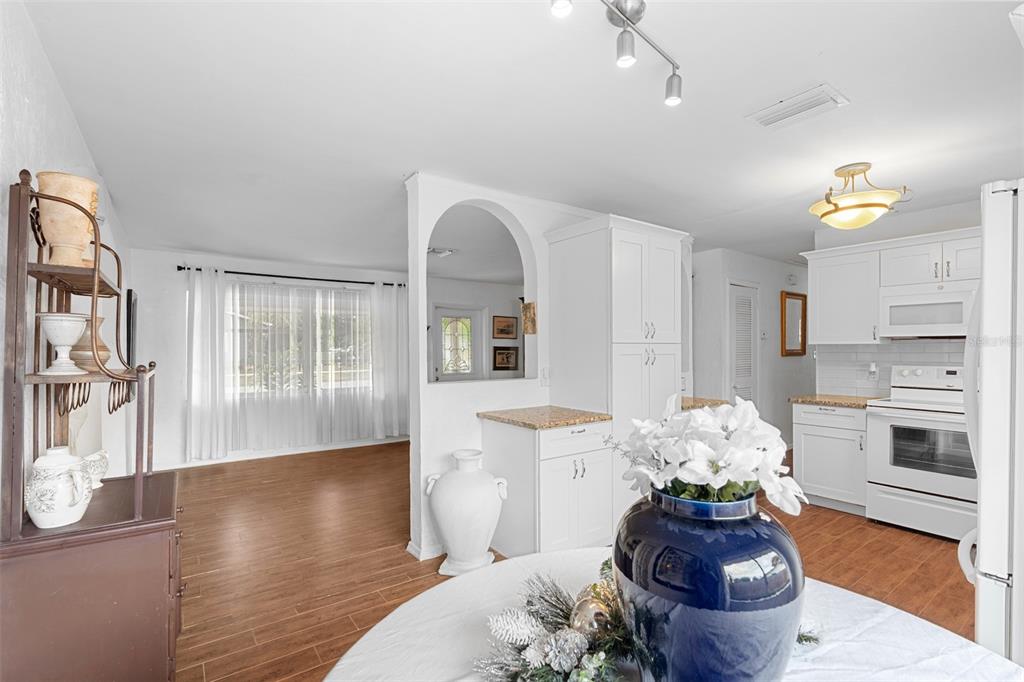 755 43rd Street St. Petersburg, FL 33713 - Photo 15 of 46 a living room with furniture fireplace and wooden floor