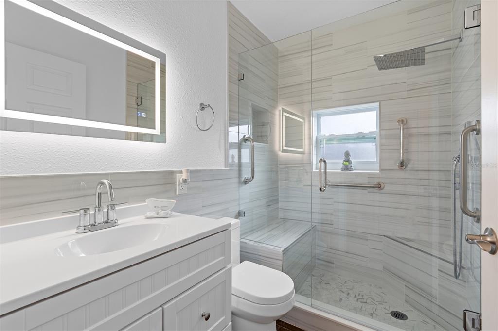 755 43rd Street St. Petersburg, FL 33713 - Photo 24 of 46 a bathroom with a sink a toilet and shower