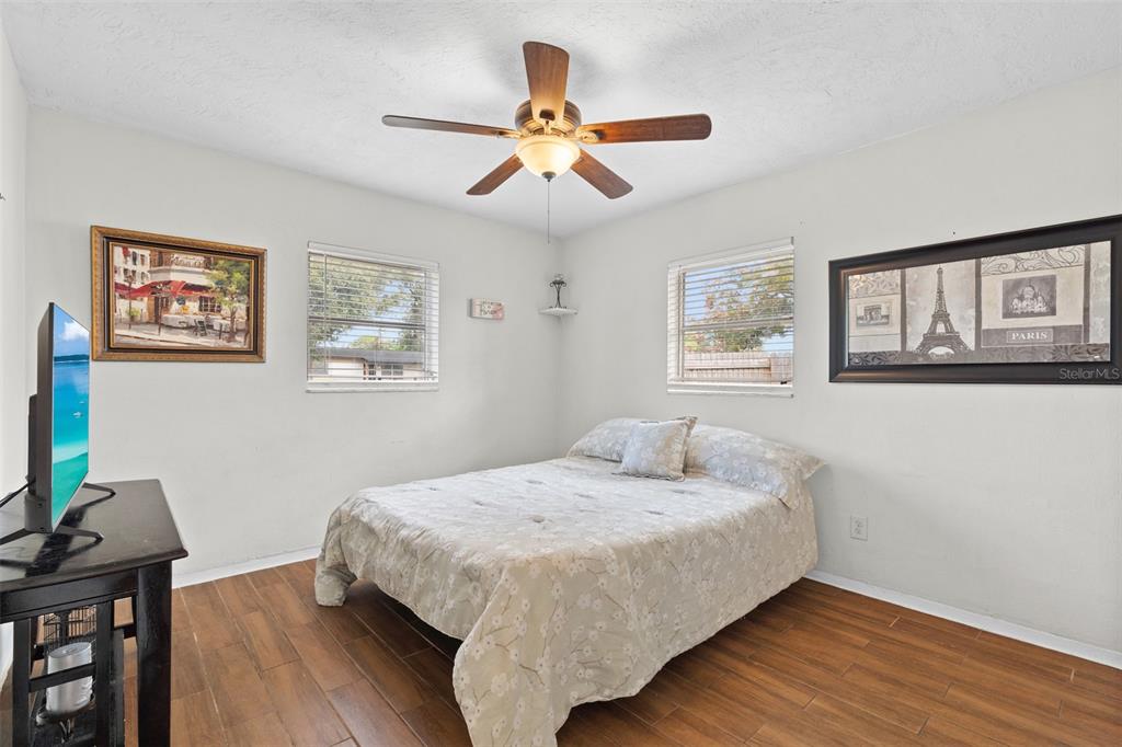 755 43rd Street St. Petersburg, FL 33713 - Photo 26 of 46 a bedroom with a bed and a chandelier