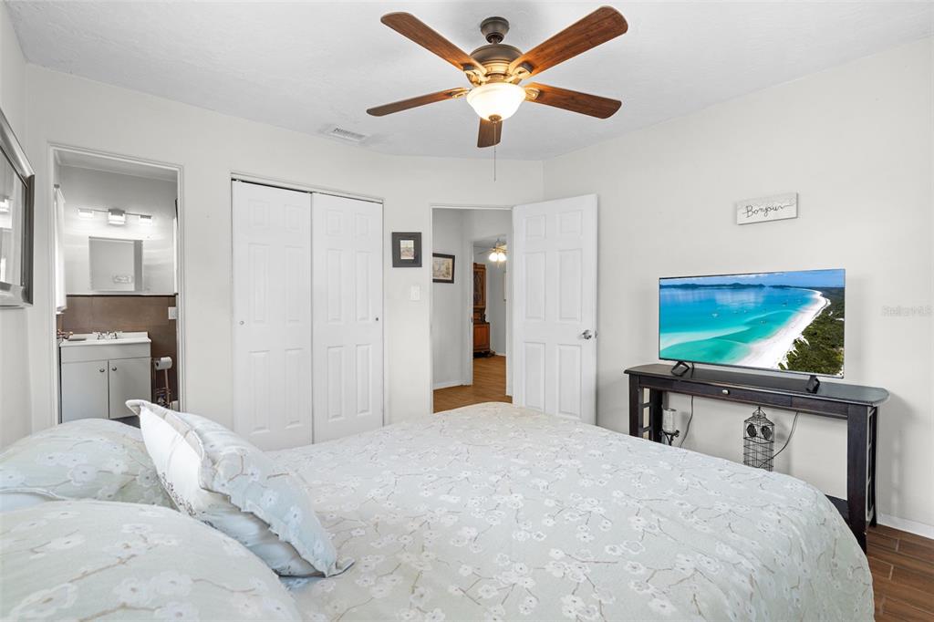 755 43rd Street St. Petersburg, FL 33713 - Photo 28 of 46 a bedroom with a bed and a flat screen tv