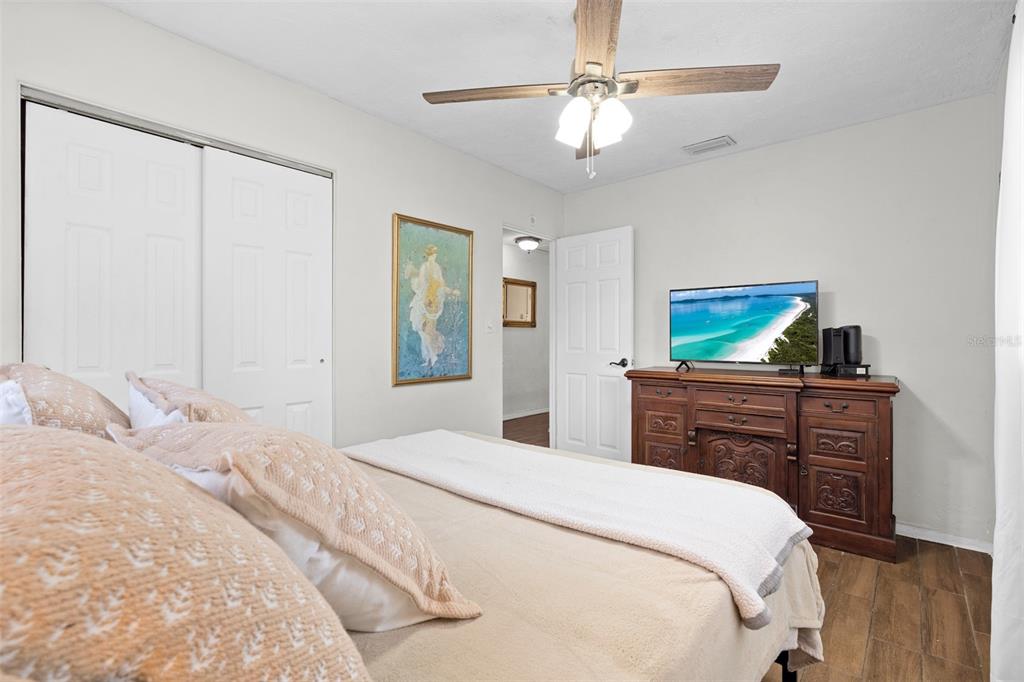 755 43rd Street St. Petersburg, FL 33713 - Photo 31 of 46 a bedroom with a bed and a chandelier