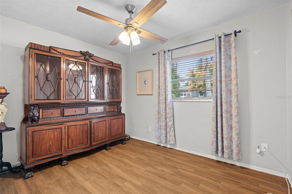 755 43rd Street St. Petersburg, FL 33713 - Photo 32 of 46 an empty room with wooden floor fan and windows