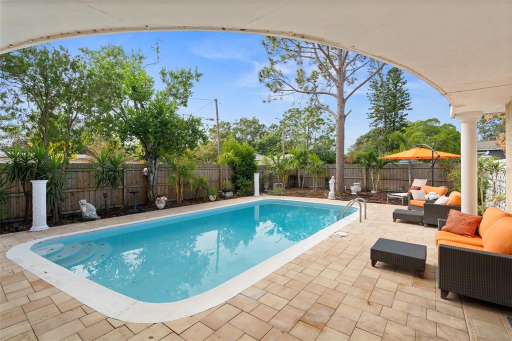 755 43rd Street St. Petersburg, FL 33713 - Photo 39 of 46 a view of a swimming pool with lounge chair