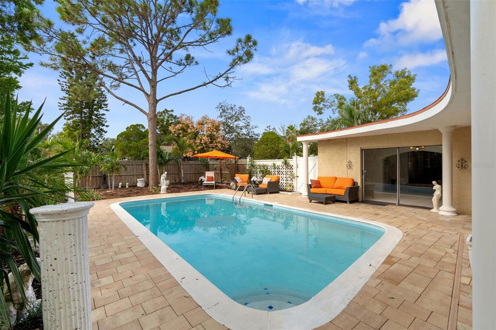 755 43rd Street St. Petersburg, FL 33713 - Photo 40 of 46 a view of a swimming pool with a patio