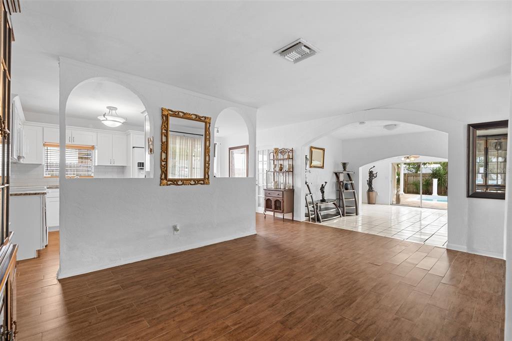 755 43rd Street St. Petersburg, FL 33713 - Photo 4 of 46 an empty room with wooden floor and windows