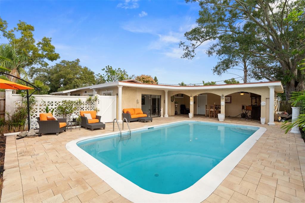 755 43rd Street St. Petersburg, FL 33713 - Photo 41 of 46 a view of a house with swimming pool and sitting area