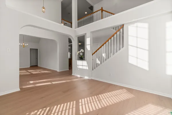 a view of an entryway with a floor to ceiling windows