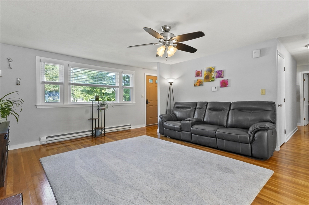 180 Hardy Pond Road Waltham, MA 02451 - Photo 8 of 31 a living room with furniture and a window