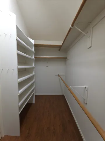 a view of an empty walk in closet