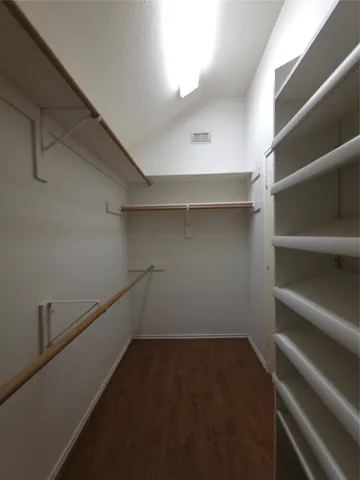a view of an empty walk in closet