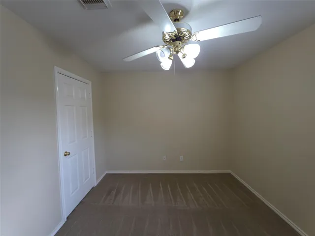 wooden floor in an empty room with a mirror