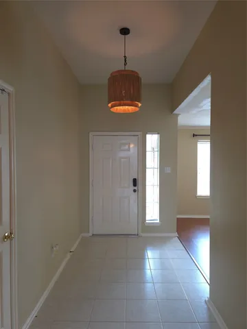 a view of a hallway with windows