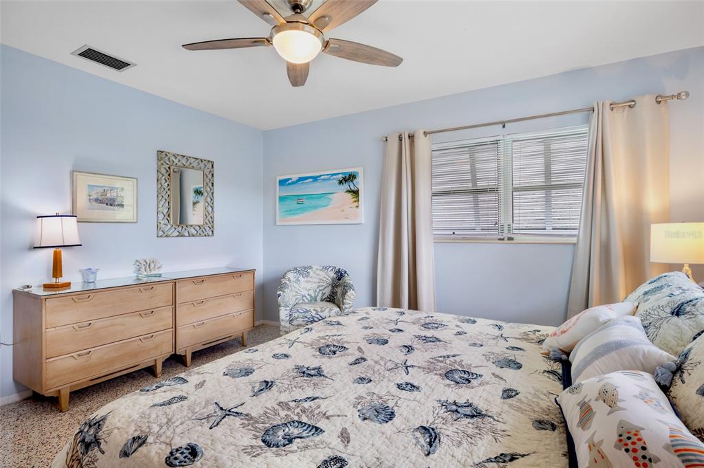 223 Roberts Road Nokomis, FL 34275 - Photo 20 of 27 a bedroom with a bed and a window