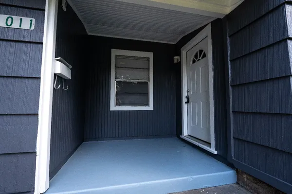 a view of an empty room with a window