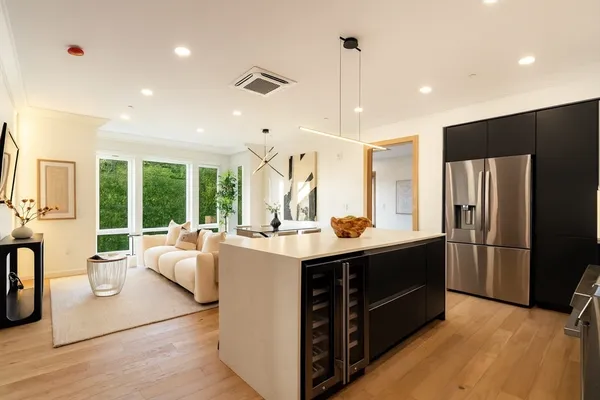 a kitchen with stainless steel appliances granite countertop a stove and a refrigerator