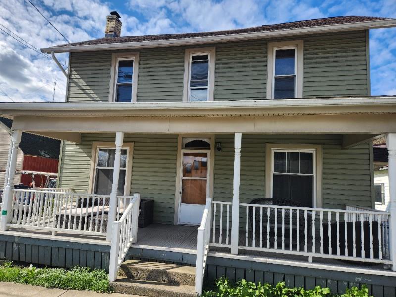 99 Main Street Grampian, PA 16838 - Photo 1 of 14 a front view of a house with a porch