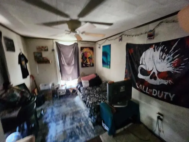 a bedroom with a bed and a mirror