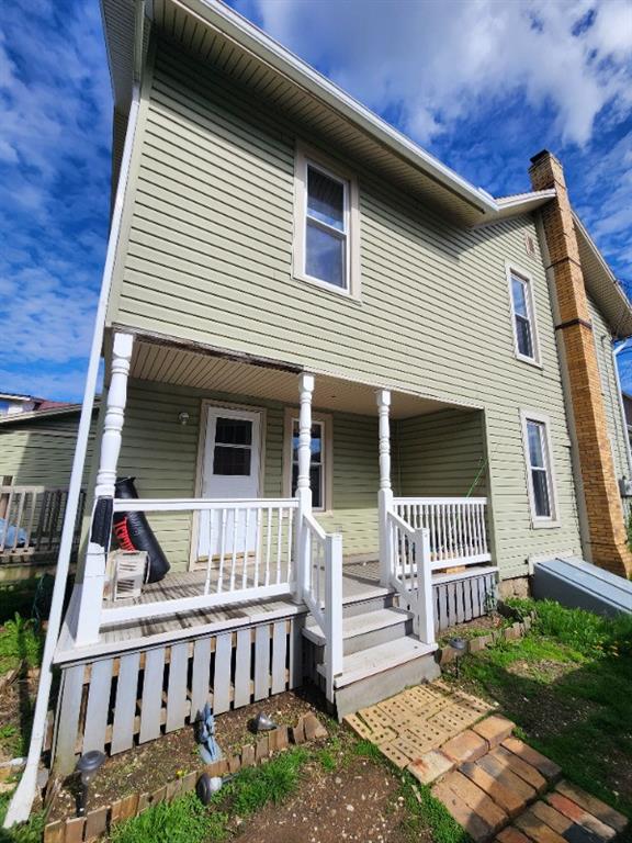 99 Main Street Grampian, PA 16838 - Photo 2 of 14 a view of house with a deck and furniture