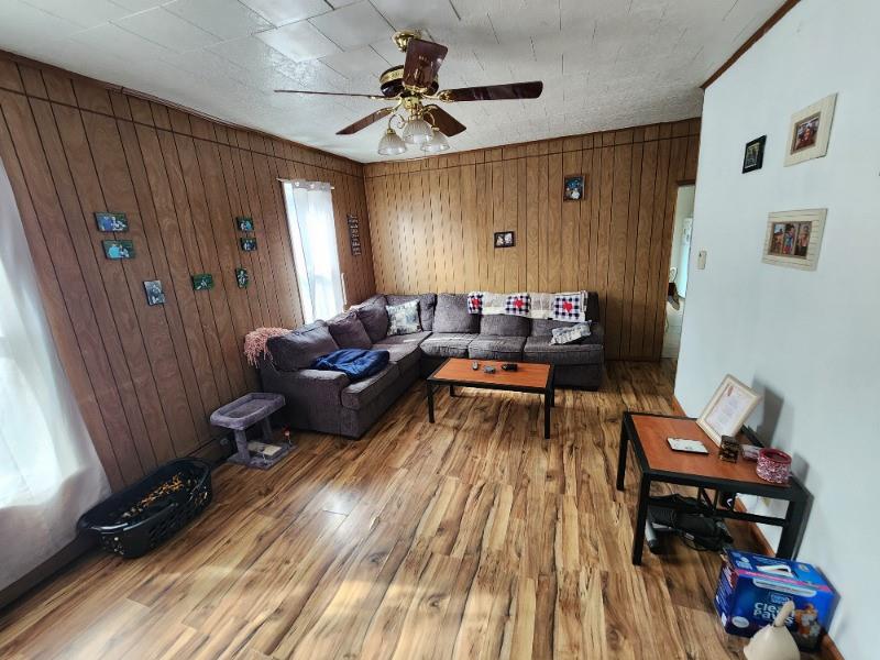 99 Main Street Grampian, PA 16838 - Photo 9 of 14 a living room with furniture and a window