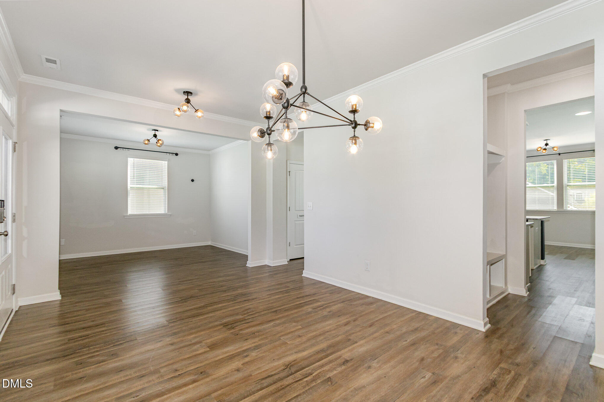 39 Calabor Court Fuquay-Varina, NC 27526 - Photo 9 of 40 a view of a room with wooden floor staircase and a ceiling fan