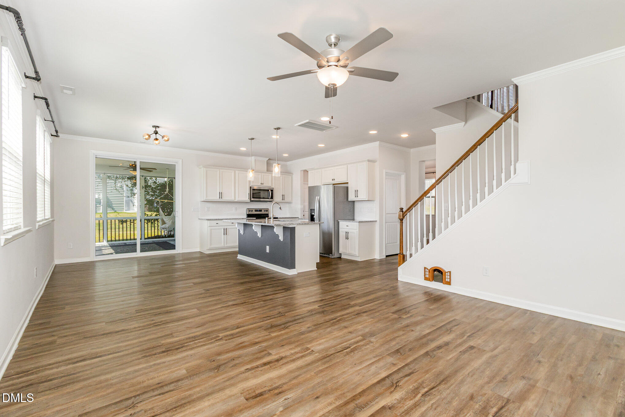 39 Calabor Court Fuquay-Varina, NC 27526 - Photo 12 of 40 a view of empty room with wooden floor and fan