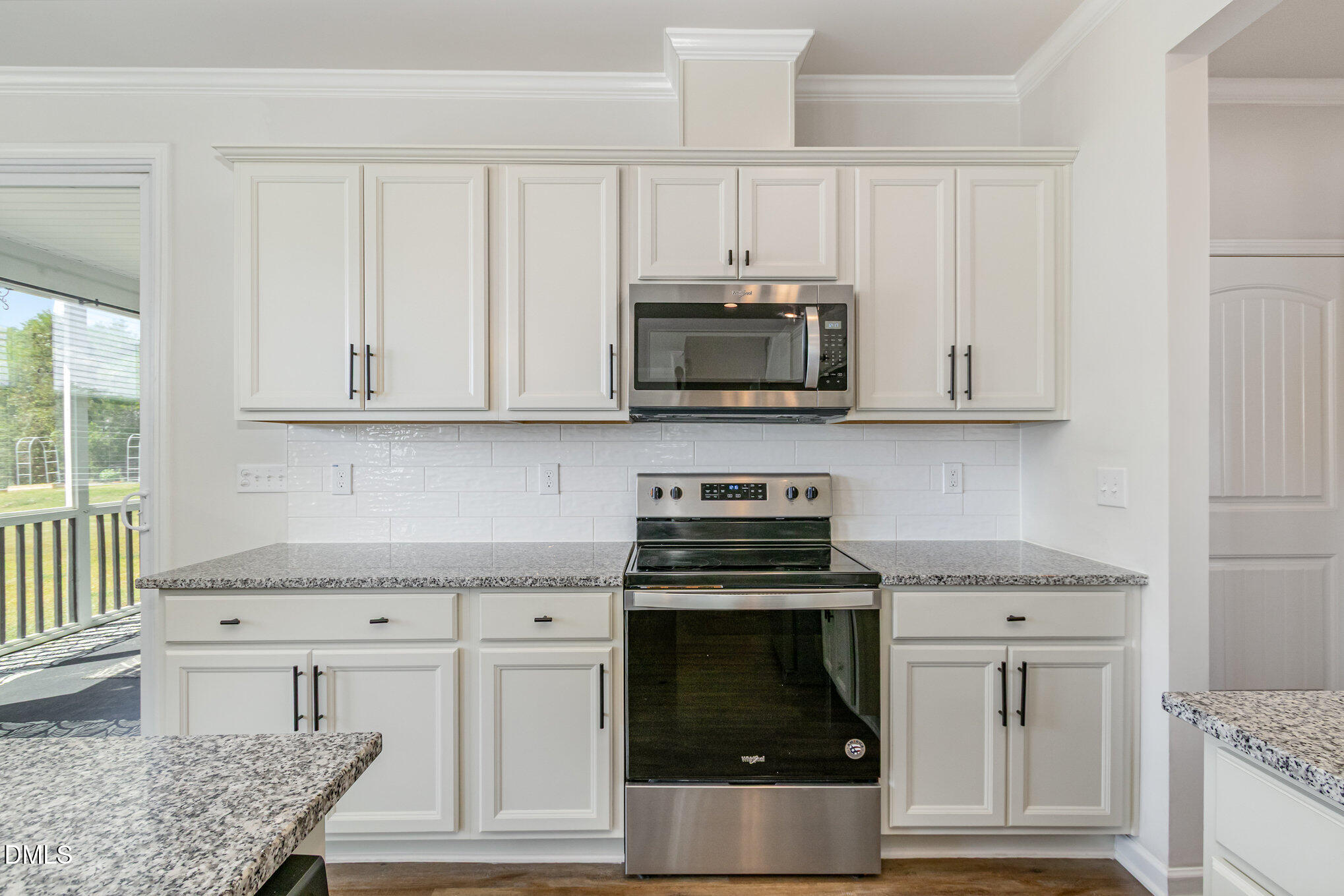 39 Calabor Court Fuquay-Varina, NC 27526 - Photo 16 of 40 a kitchen with stainless steel appliances granite countertop a stove microwave and cabinets