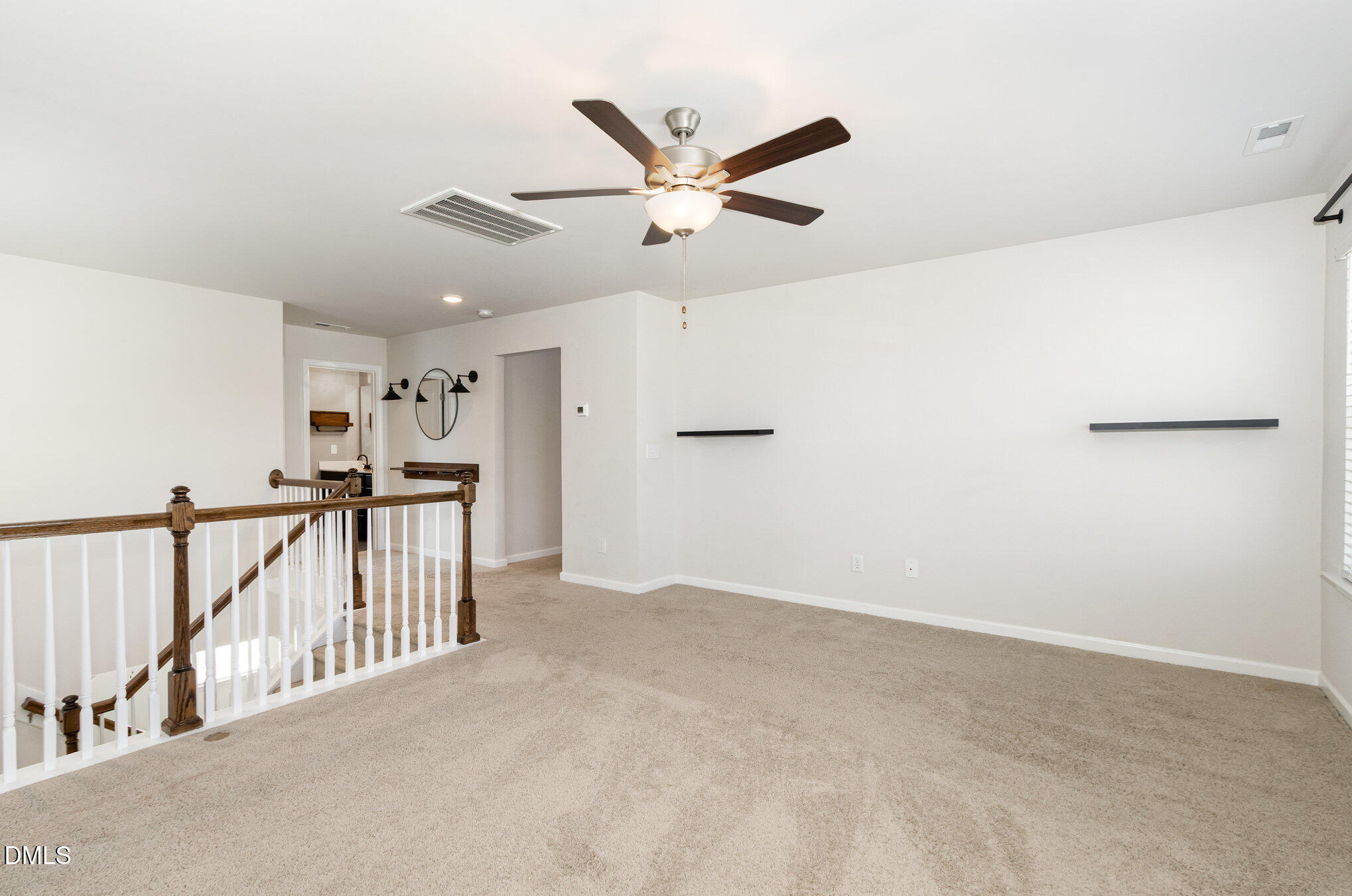 39 Calabor Court Fuquay-Varina, NC 27526 - Photo 21 of 40 a view of a hallway with a ceiling fan