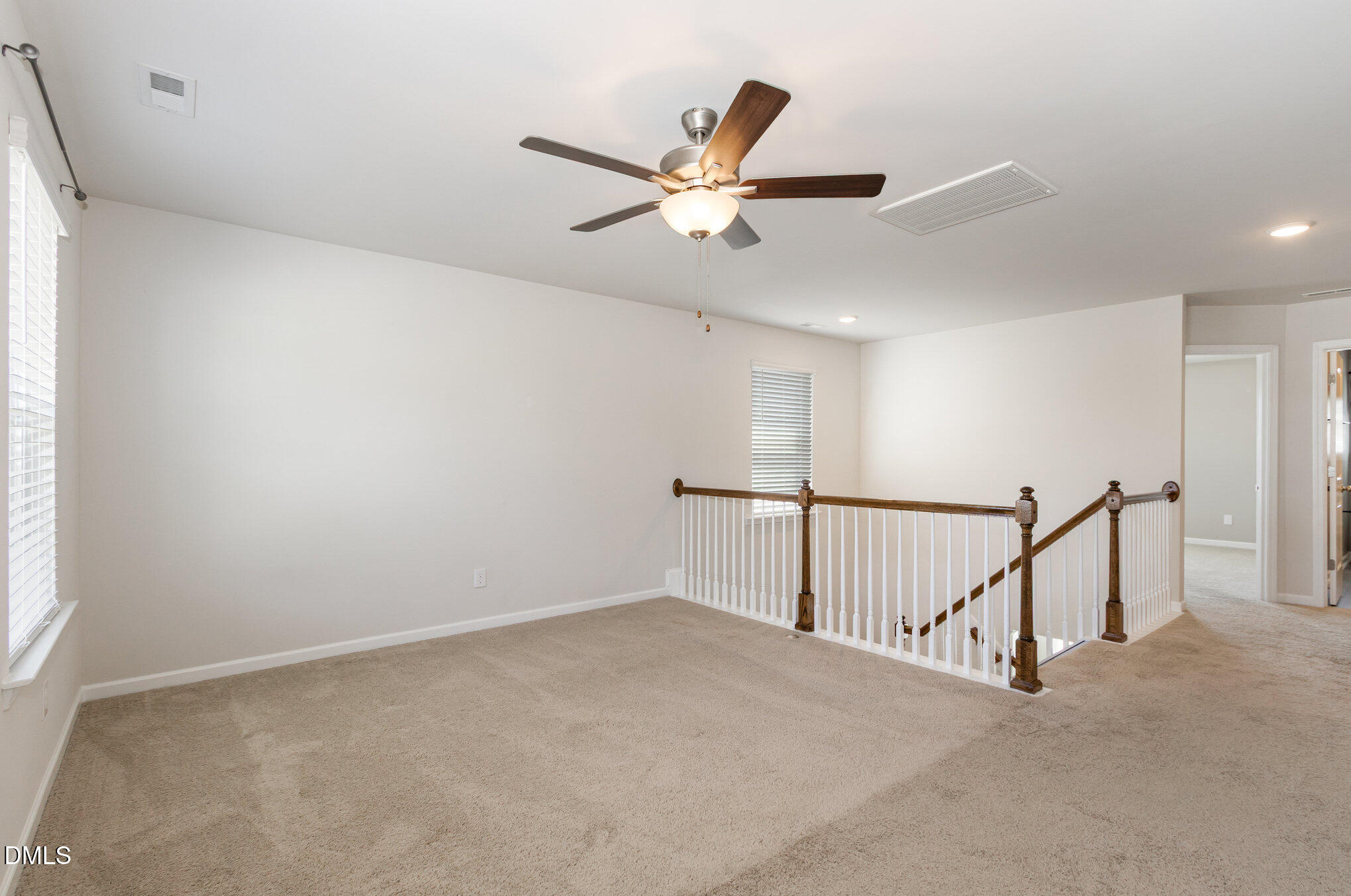 39 Calabor Court Fuquay-Varina, NC 27526 - Photo 22 of 40 a view of a hallway with a ceiling fan
