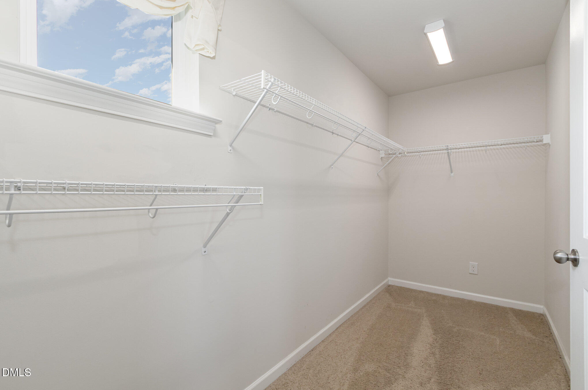 39 Calabor Court Fuquay-Varina, NC 27526 - Photo 28 of 40 a view of a room with racks on the wall