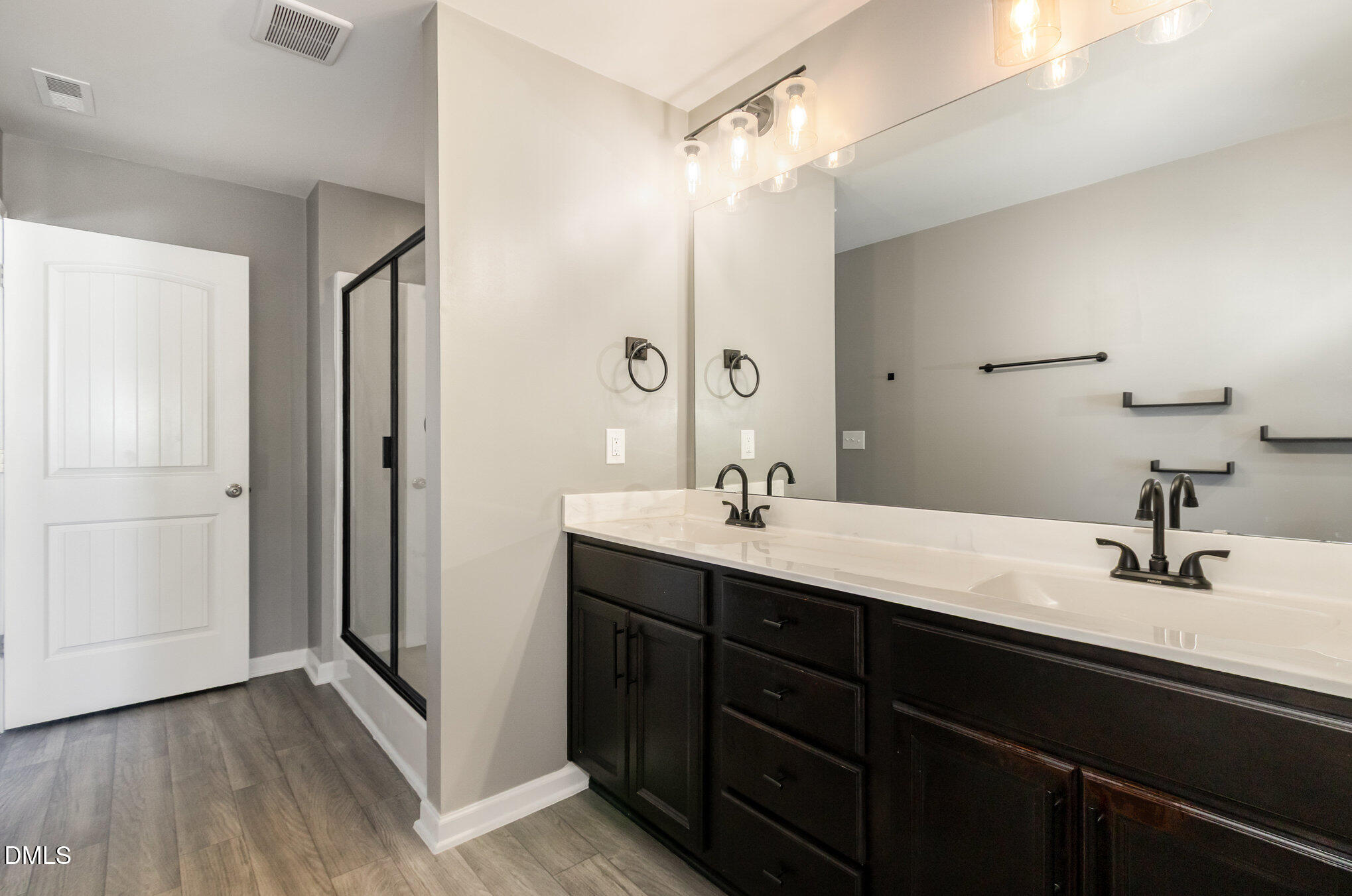 39 Calabor Court Fuquay-Varina, NC 27526 - Photo 30 of 40 a bathroom with a double vanity sink and mirror