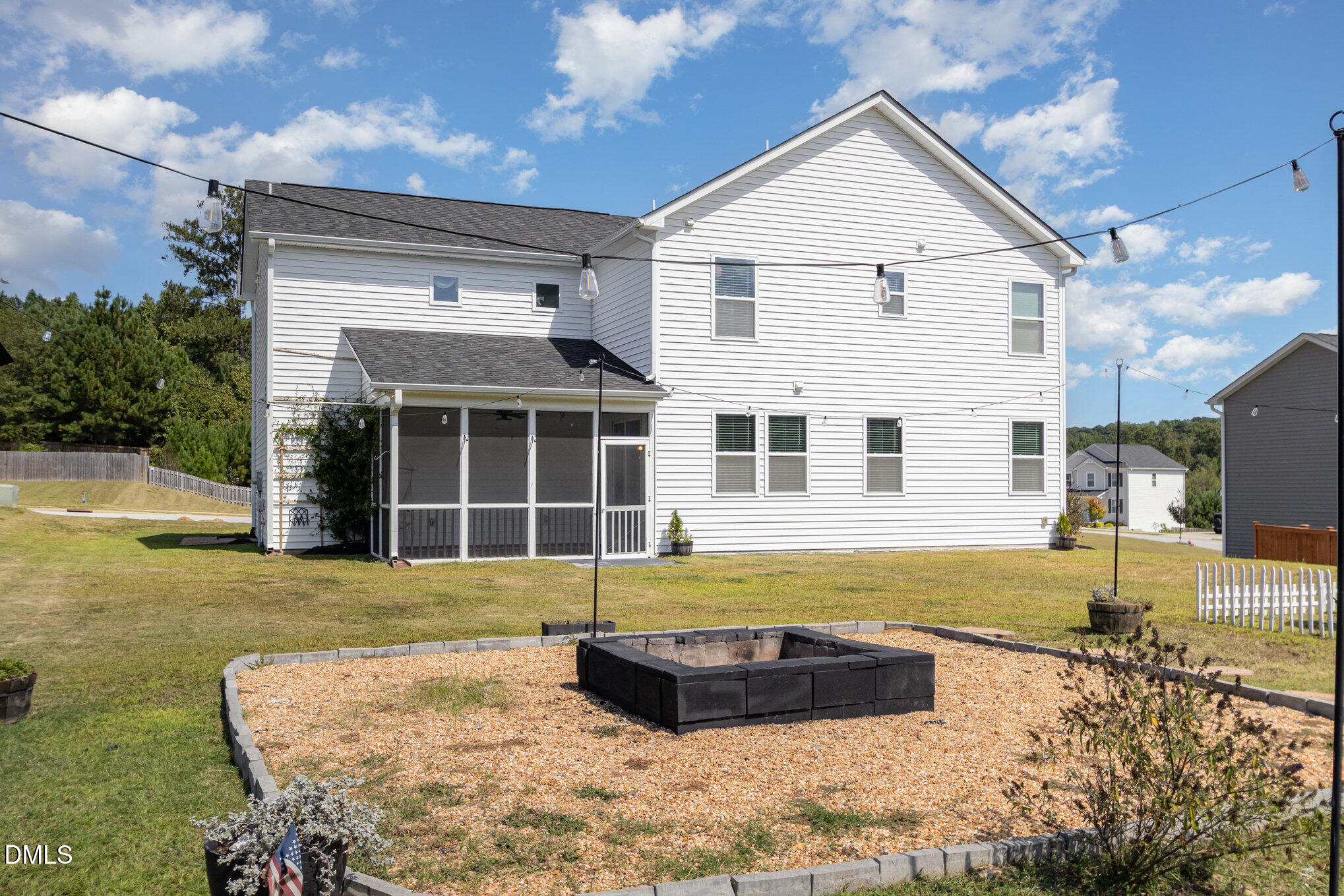 39 Calabor Court Fuquay-Varina, NC 27526 - Photo 38 of 40 a view of a white house with a yard
